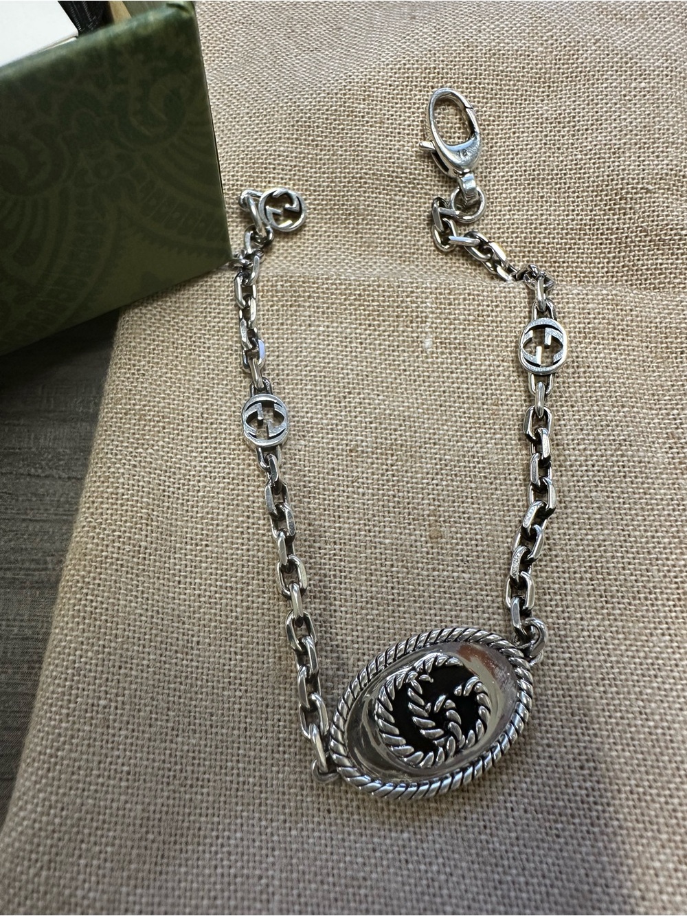 Gucci Silver-Tone Rope Medallion Chain Bracelet with Black Enamel Accent